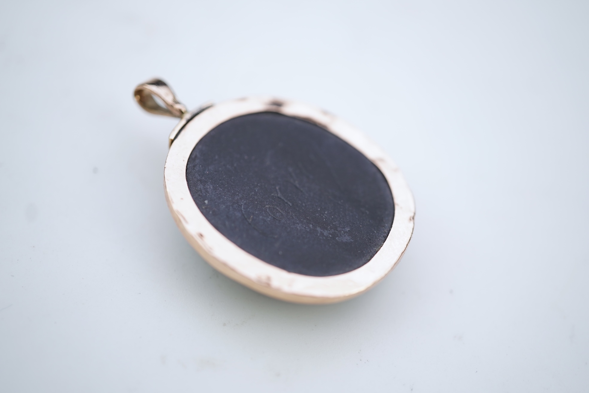 An unusual lava cameo pendant, late 19th century